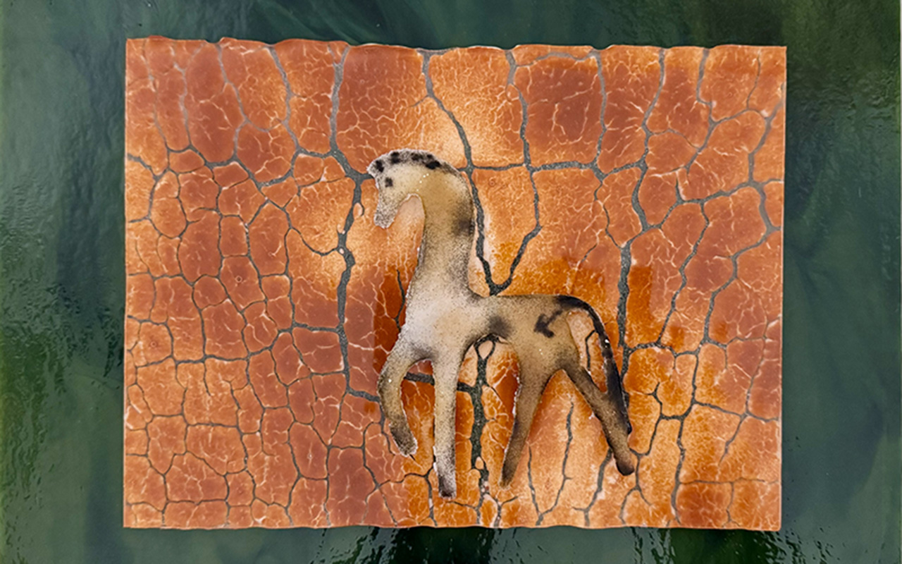 graphic of a horse on a cracked surface 